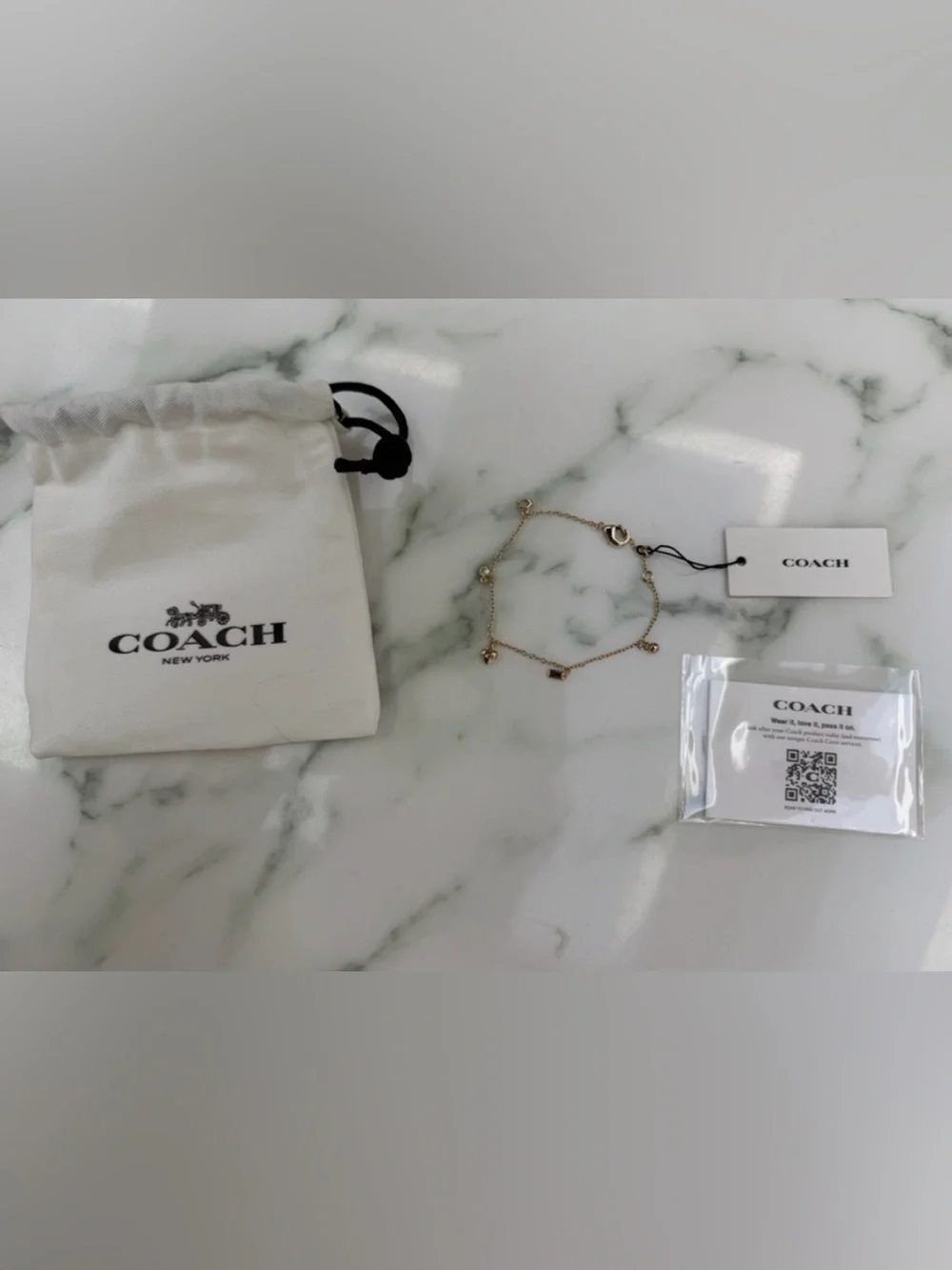 Gold Coach Charm Bracelet with Heart &  Lock Charms. *NEW COMES WITH DUST BAG*